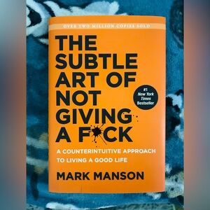 The Subtle Art of Not Giving a F*ck by Mark Manson - Orange Hardcover